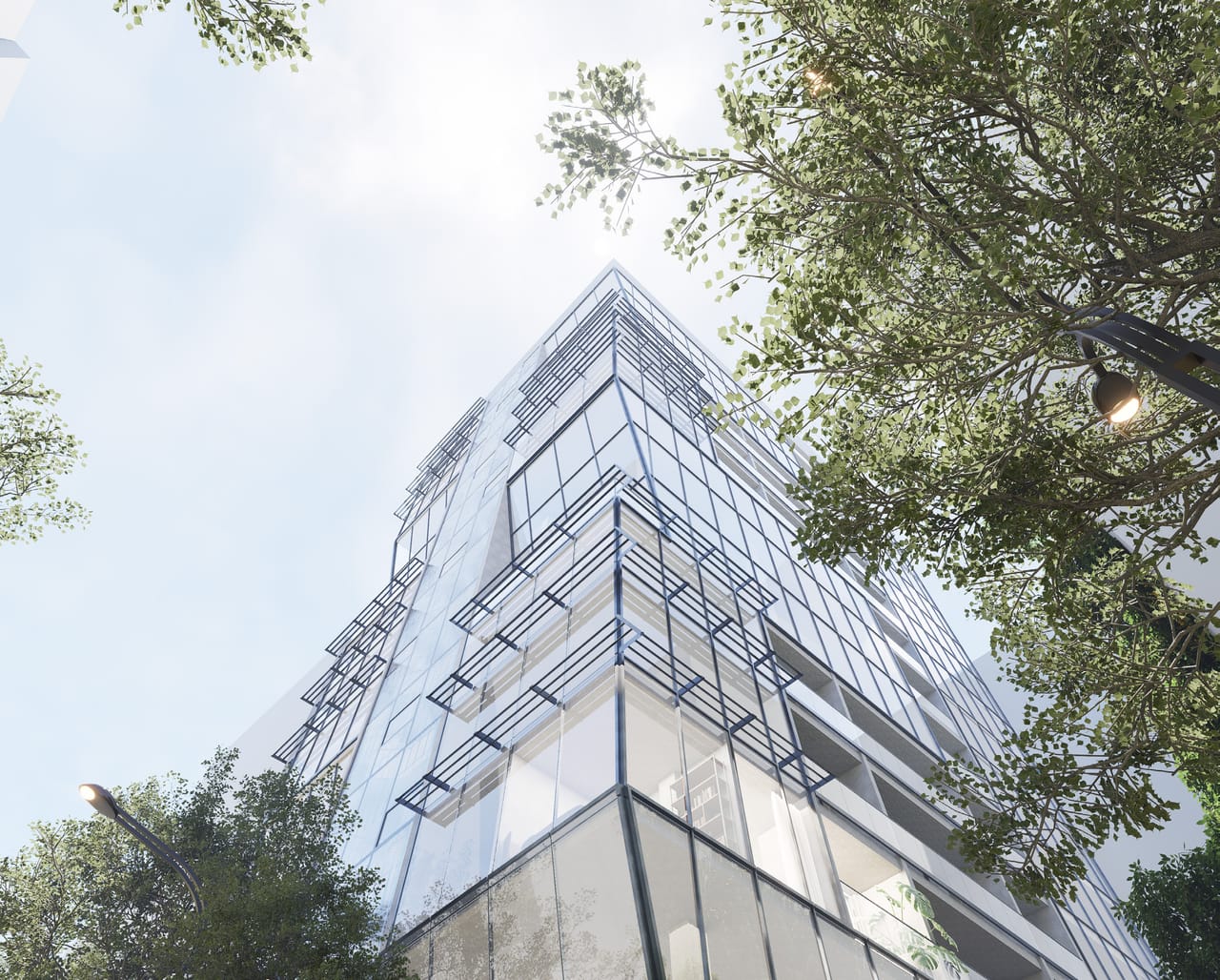 Worm's-eye render of a glass tower with stepped, tilted balconies and horizontal fins, framed by street trees against a pale sky