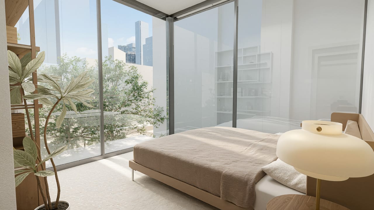 Render of a bedroom with a low bed and a round yellow lamp beside floor-to-ceiling glass looking out over treetops to a distant skyline