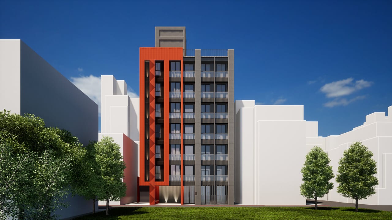 Render of a tall apartment building with a bright orange-red terracotta facade on its left half and a grey screened facade with balconies on its right, between white neighbouring buildings, under a deep blue sky with trees and a lawn at its foot