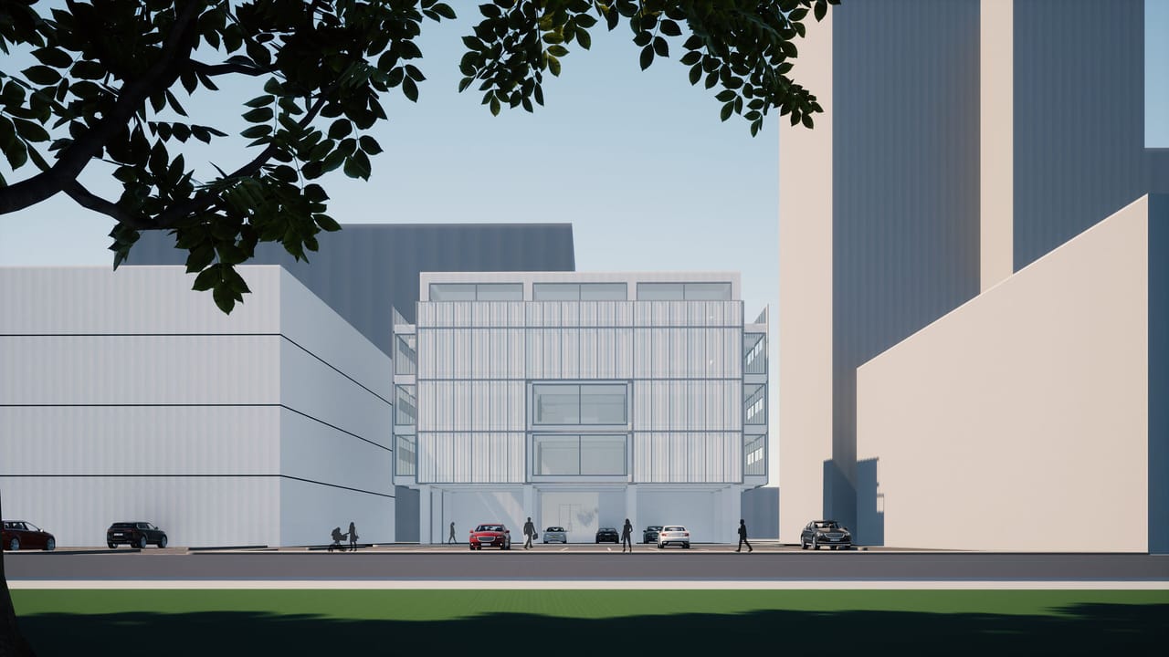 Render across a lawn and a car park to a pale glazed building beside a darker block, with a tall building behind and a tree branch across the top