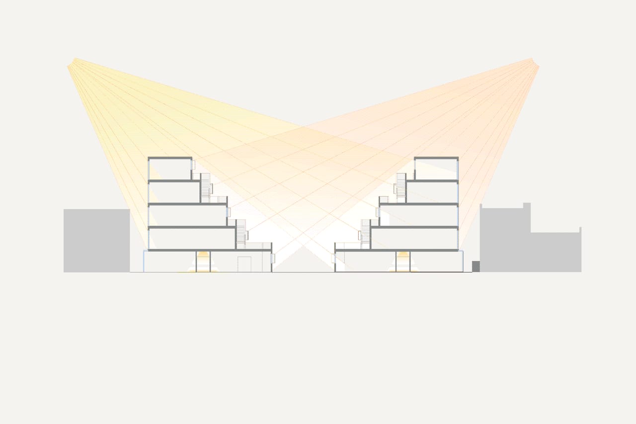 Two stepped blocks in section, with fans of sunlight rays crossing the space between them